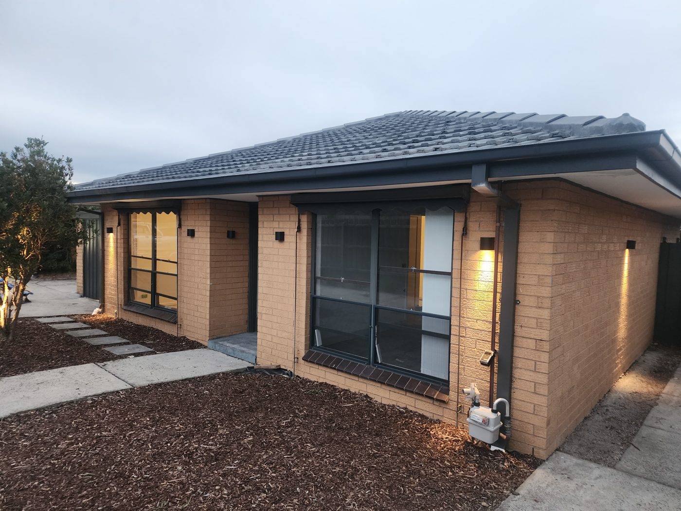 Exterior painting — fresh finish on home at dusk