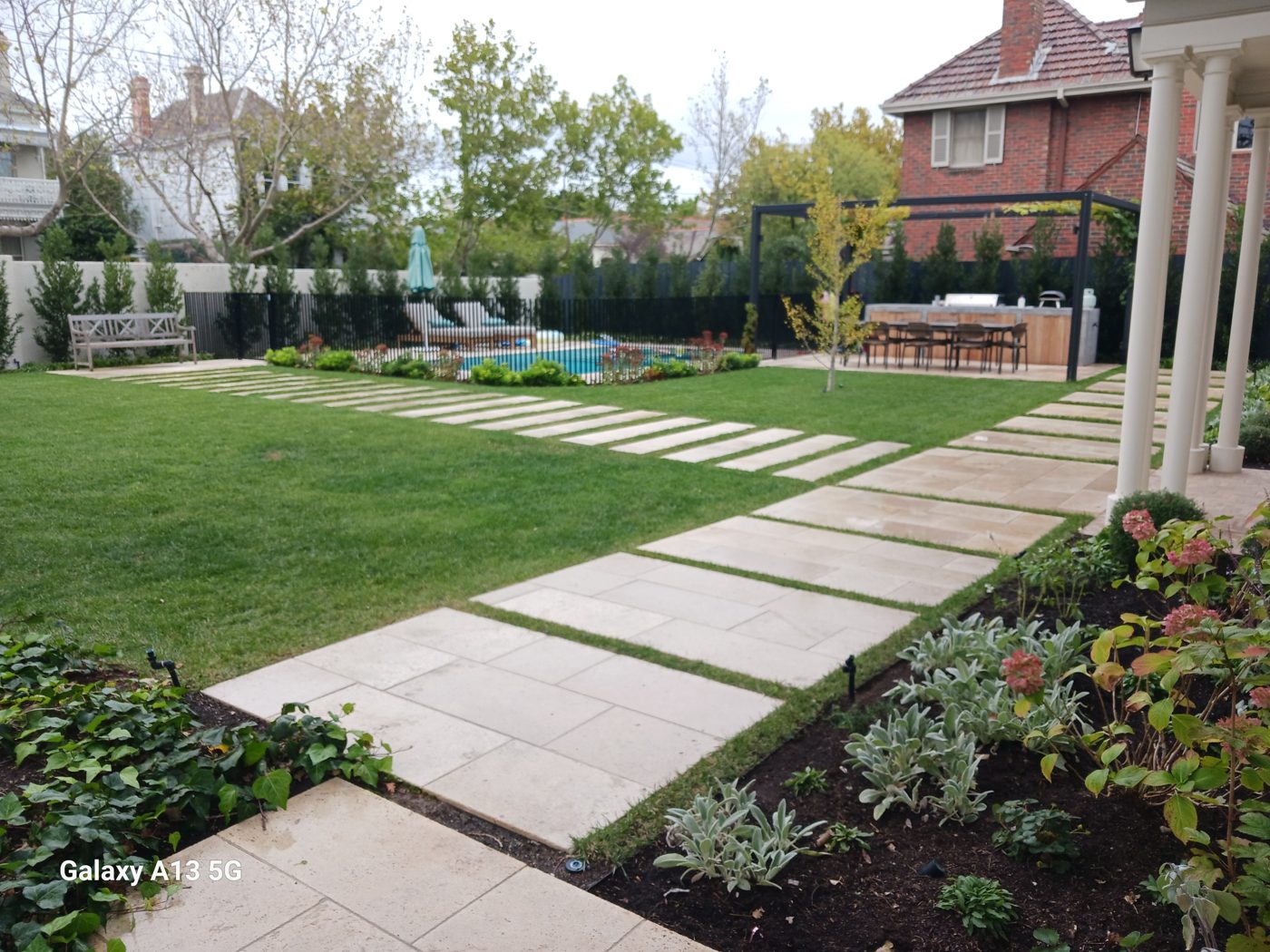 Paver and lawn feature — Stone pavers set in turf